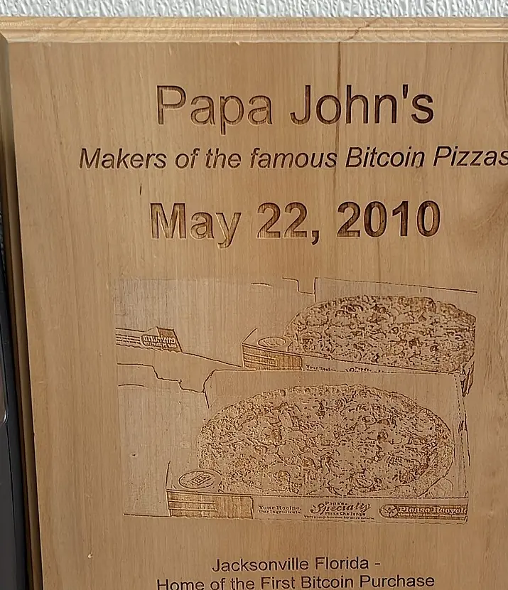 Plaque at the Jacksonville Papa John's: “Makers of the famous Bitcoin Pizzas, May 22, 2010”